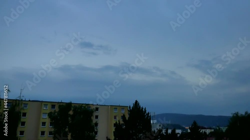 Slowly approaching storm with lightning in the sky over the city Usti nad Labem, Czech Republic, in the early evening.