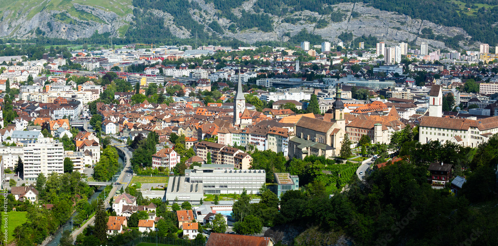 Aerial view of Chur townscape overlooking reformed church of St. Martin and Catholic Cathedral on summer day, canton of Graubunden, Switzerland..