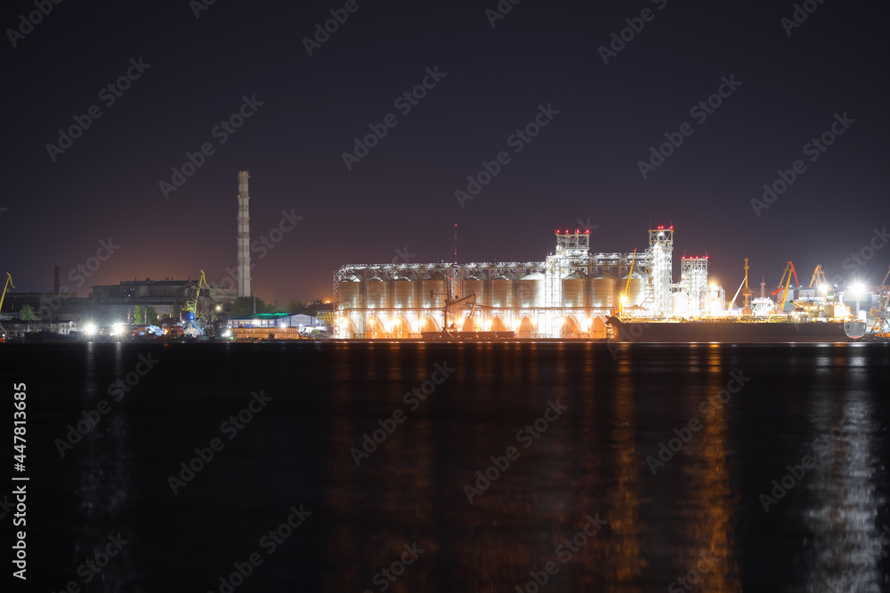 View of illuminated harbor at night