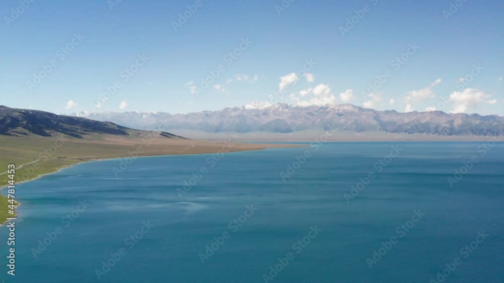 Lake and grassland with a sunny day.