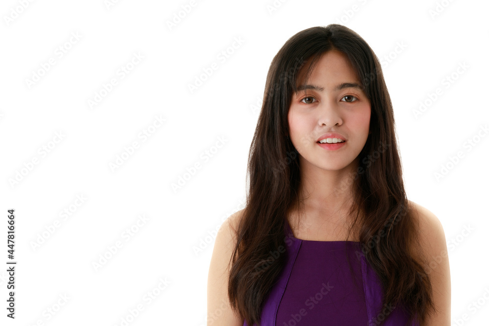 Serene charming ethnic female with long hair and in trendy clothes looking at camera on white background Serene charming ethnic female with long hair and in trendy clothes looking at camera on white background
