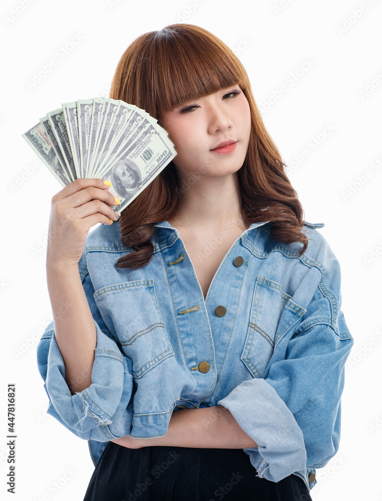 Asian woman smiles and holding American banknotes.. Asian woman smiles and holding American banknotes..