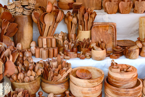 Kitchen utensils made of wood at a street market in Mexico. Mexican handicrafts.