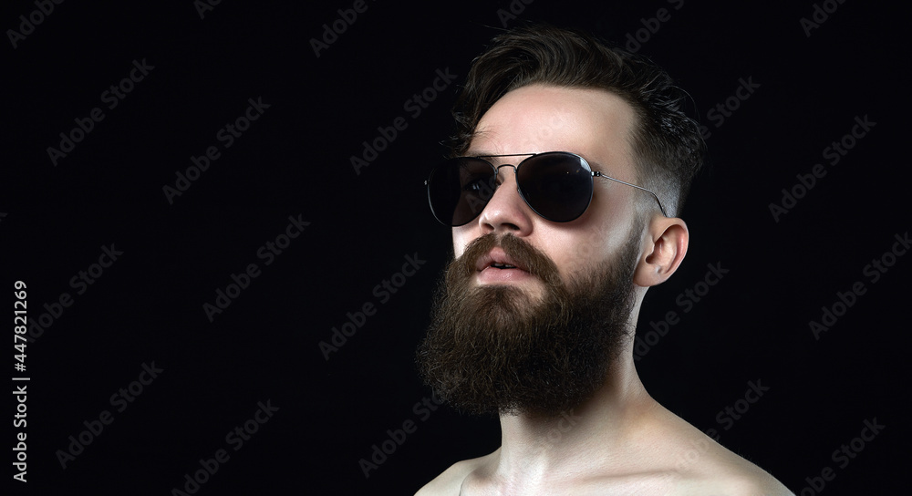 Man in sunglasses. Brutal hipster boy with beard Man in sunglasses. Brutal hipster boy with beard