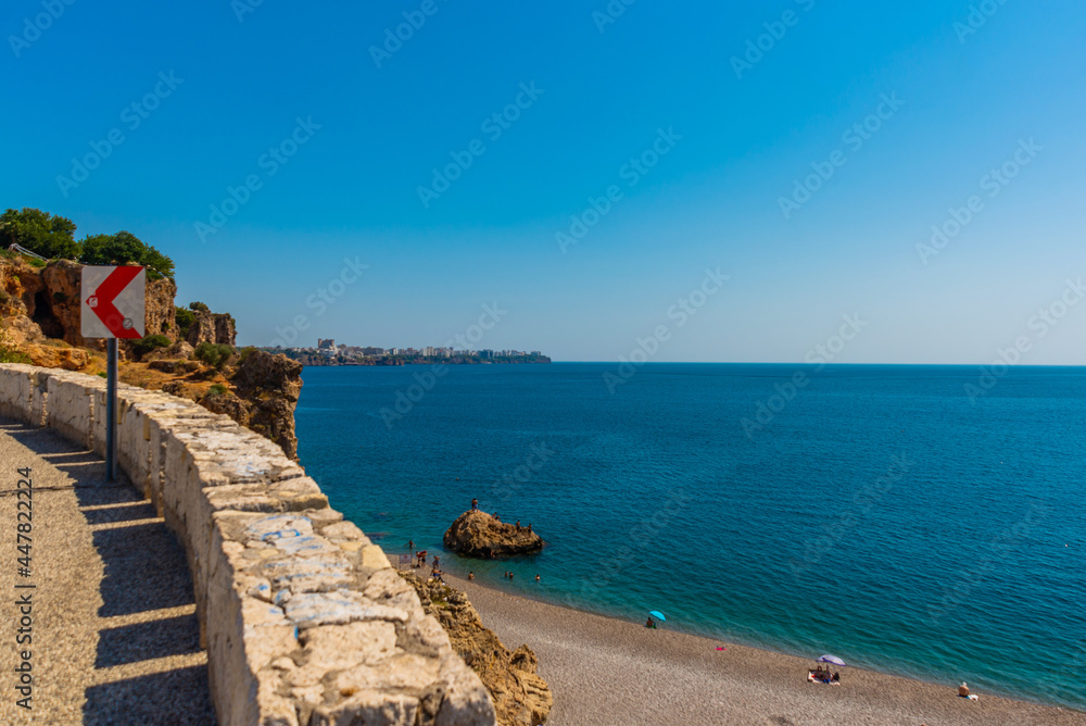 ANTALYA, TURKEY: Serpentine road leads to Konyaalti beach on a sunny summer day in Antalya. ANTALYA, TURKEY: Serpentine road leads to Konyaalti beach on a sunny summer day in Antalya.