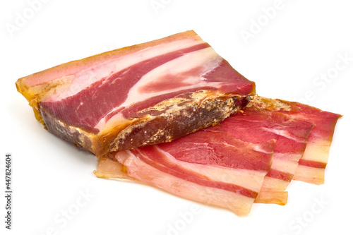 Traditional smoked jamon, isolated on white background. High resolution image.