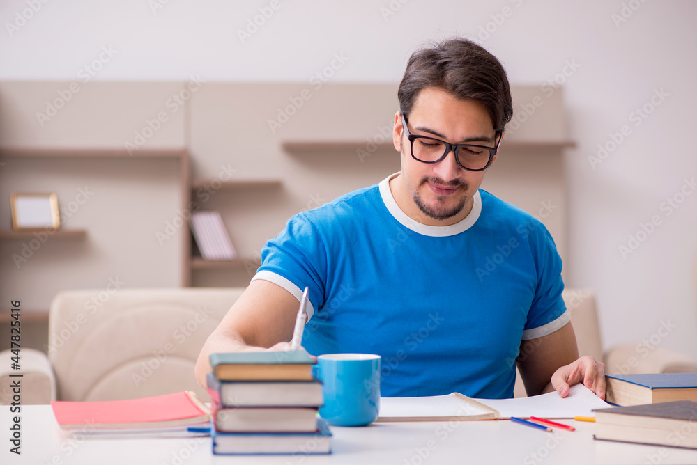 Young male student studying at home Young male student studying at home