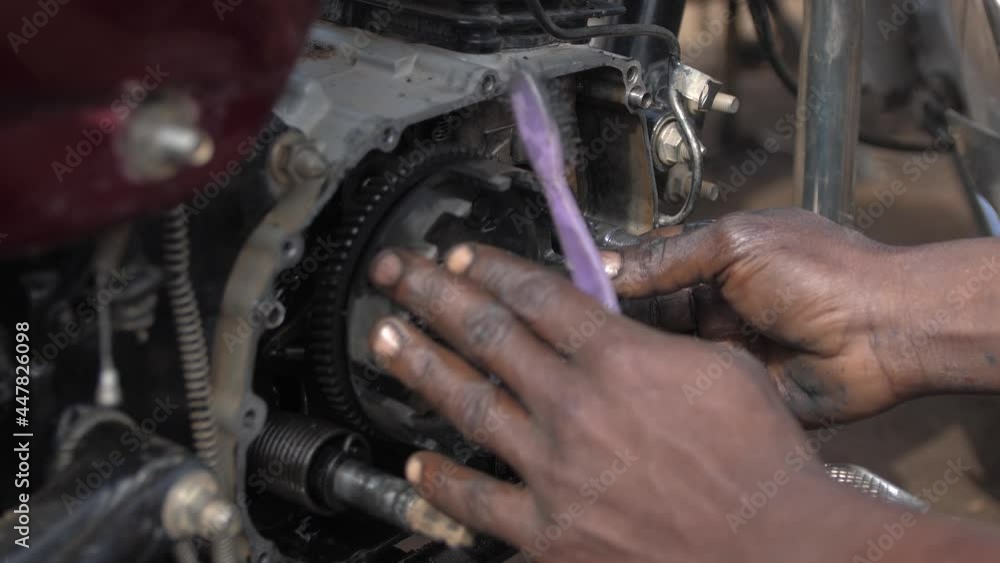24th may 2021, Lagos Nigeria: Africa local Mechanic Is Checking and repairing the engine of cars and truck at the mechanic Motor garage . 24th may 2021, Lagos Nigeria: Africa local Mechanic Is Checking and repairing the engine of cars and truck at the mechanic Motor garage .