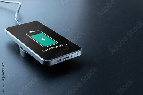 Wireless charger. Mobile cell phone charge battery from wireless smart charger. Modern technology concept.