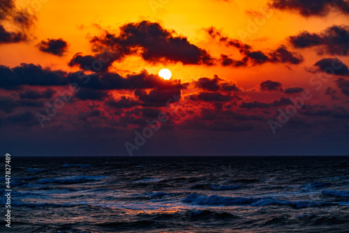 Colorful dramatic sunset on the coast