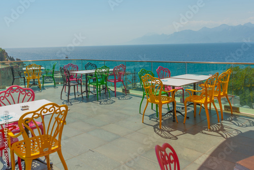 ANTALYA  TURKEY  Cafe with colorful chairs with sea and mountain views in Antalya.