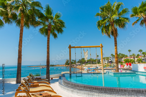 ANTALYA  TURKEY  Swimming pool and swing on the territory of Fosforlu beach on a sunny day.