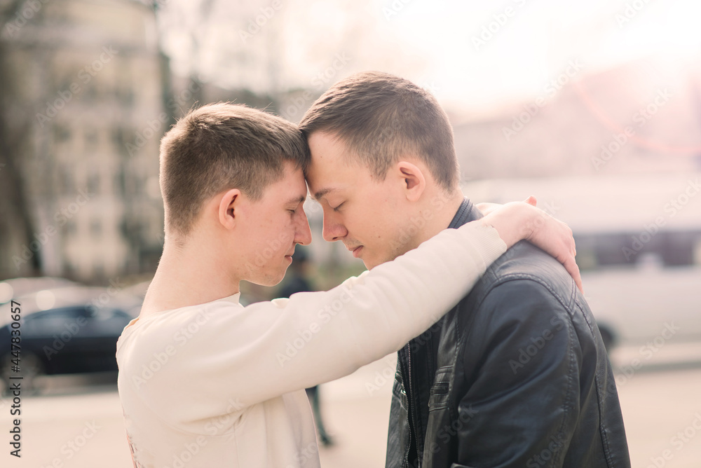 Gay couple walking in city centre, lifestyle Gay couple walking in city centre, lifestyle