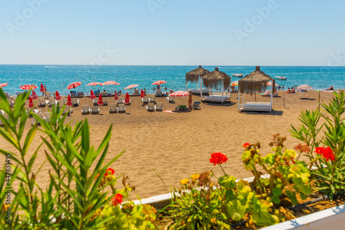 ANTALYA, TURKEY: Gazebos, sun loungers and umbrellas on the Lara beach on a sunny summer day in Antalya.