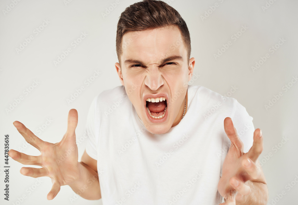 emotional man emotions white t-shirt studio Crazy emotional man emotions white t-shirt studio Crazy