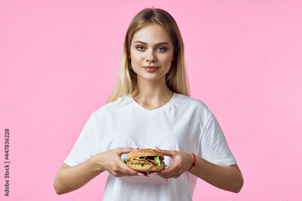 woman in white t-shirt hamburger snack delicious food restaurant woman in white t-shirt hamburger snack delicious food restaurant
