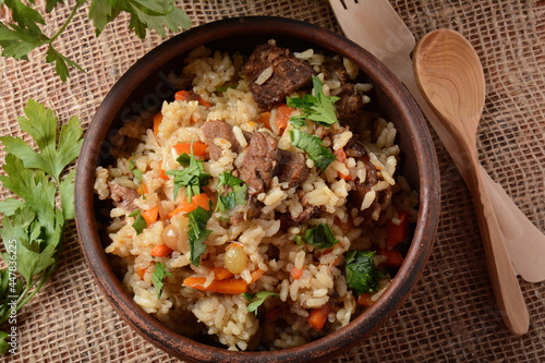 Fried and stewed beef meat with rice. Uzbek cuisine  pilaf (plov) photo