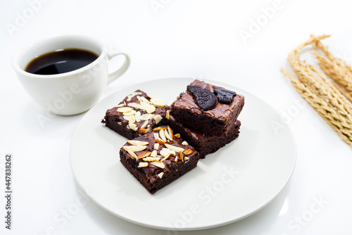 Brownie in dish on white background.