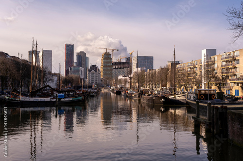 Rotterdam City, Oude Haven oldest part of the harbour, historic ship yard dock, Old Ship, Openlucht Binnenvaart Museum, Haringvliet and the Willemsbrug bridge at Dusk in Summer photo