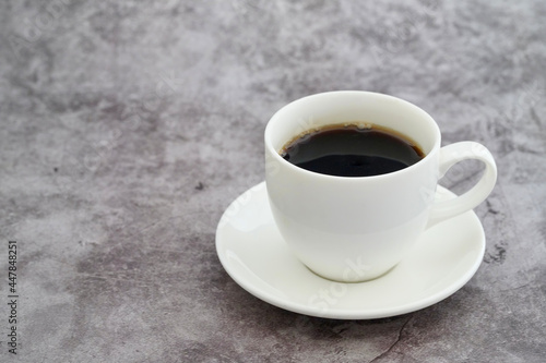 black coffee with white cup on retro background