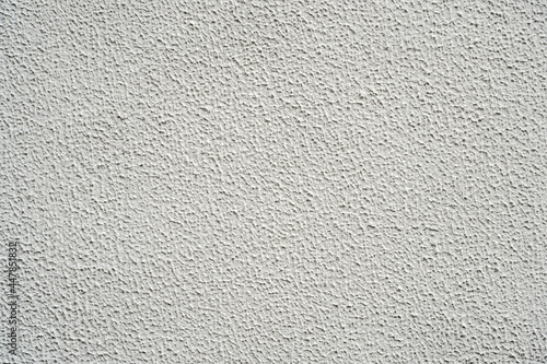 Stucco texture of cement wall, White painted and surface rough of concrete wallpaper background