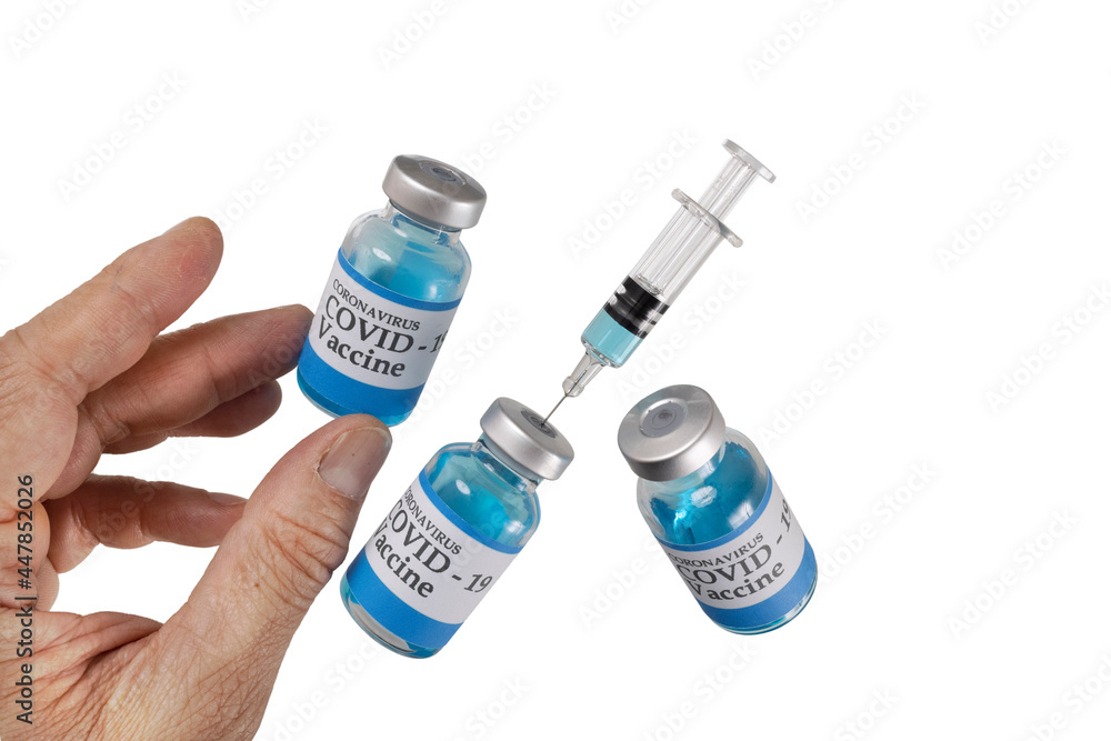 A hand with floating glass vials labelled covid-19 vaccine and a glass syringe. A hand with floating glass vials labelled covid-19 vaccine and a glass syringe.