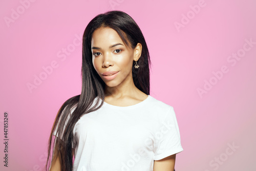 attractive african woman fashion hairstyle cropped view pink background