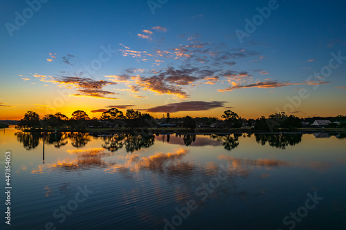 Ohmas Bay Sunset with Clouds and Reflections photo