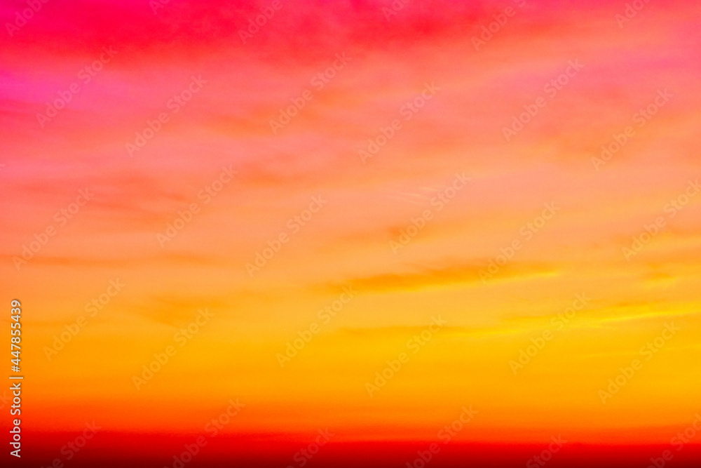 Phantasmagorical vivid colorful cloudscape at sunset time. Abstract nature background.