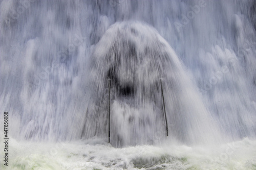 von herabstürtzenden Wassermassen umspühlte Treppe photo