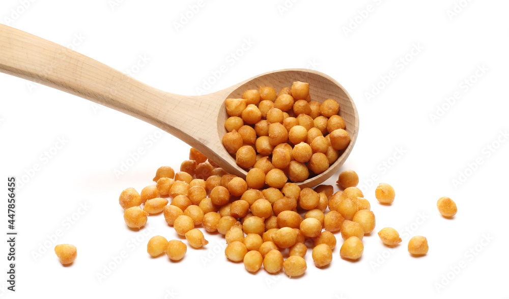 Soup pearly pastry puffs, crispy and salty wheat balls with wooden ladle, spoon isolated on white background Soup pearly pastry puffs, crispy and salty wheat balls with wooden ladle, spoon isolated on white background