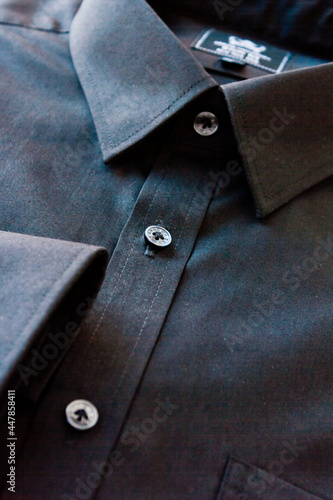 Close up of dark Men's shirt.