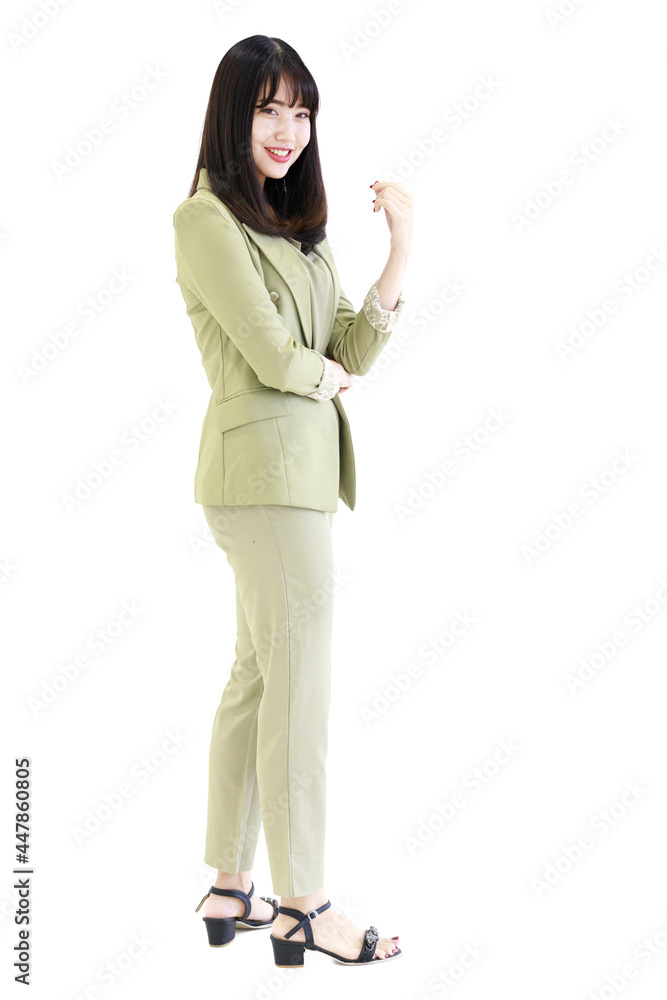 Vertical side view full-body portrait shot of attractive smiling young adult Asian woman in light green formal clothes looking at the camera and posing in the studio isolated with white background Vertical side view full-body portrait shot of attractive smiling young adult Asian woman in light green formal clothes looking at the camera and posing in the studio isolated with white background