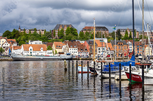 Sail boats in the port of Flensburg, St. Jorgen's Church in the background. Schleswig-Holstein in Germany photo