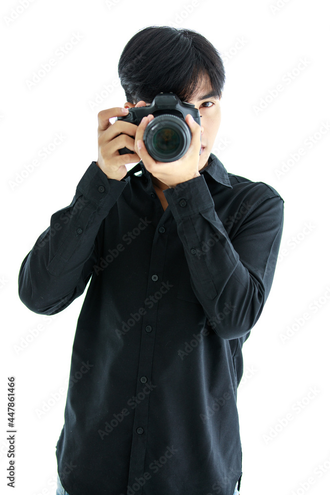 Asian young handsome successful happy male model photographer wears black long sleeve shirt hold DSLR camera and pose in shooting gesture Asian young handsome successful happy male model photographer wears black long sleeve shirt hold DSLR camera and pose in shooting gesture