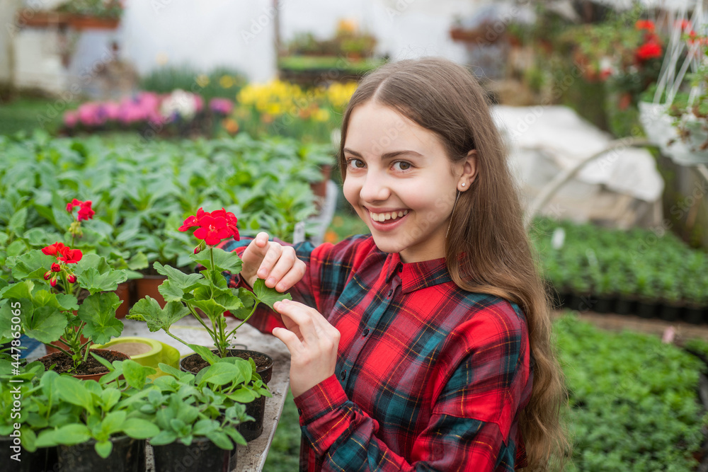 gardening activity for kid. happy teen girl florist in greenhouse. spring and summer gardening activity for kid. happy teen girl florist in greenhouse. spring and summer