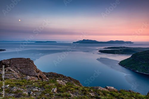 Summer sunset over the Isle of Rum and Eigg on the west coast of Scotland
