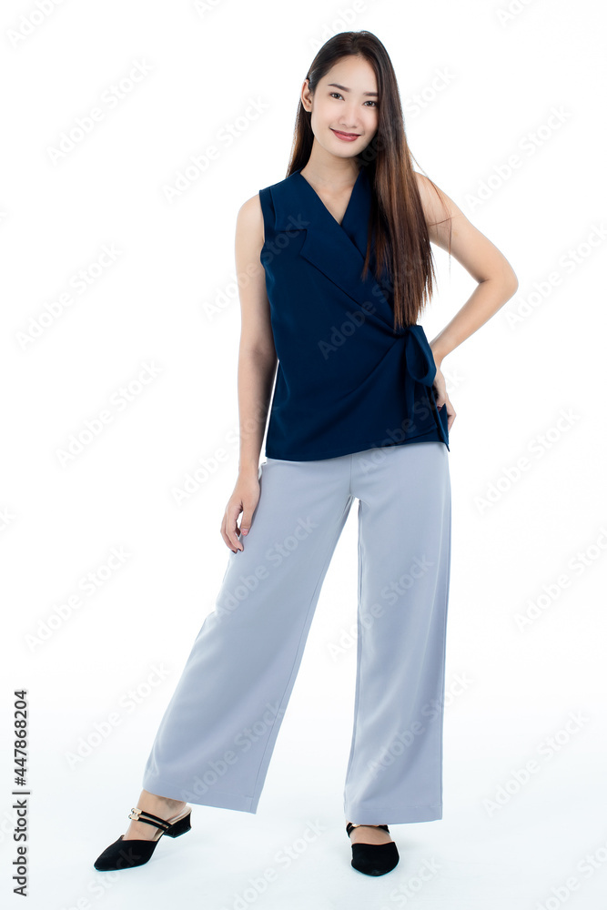 Full body shot of cute delighted young Asian woman smiling and looking at camera isolated on while background. Full body shot of cute delighted young Asian woman smiling and looking at camera isolated on while background.