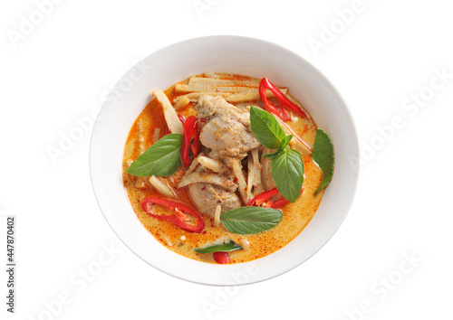 Thai chicken and bamboo shoot curry in ceramic bowl on white background photo