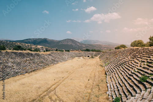 The giant stadium in the ancient city of Aphrodisias. Ancient stadium with 30 thousand seats. Historical buildings in the ancient city of Aydın Karacasu. Ruins in the ancient city. Selective focus.