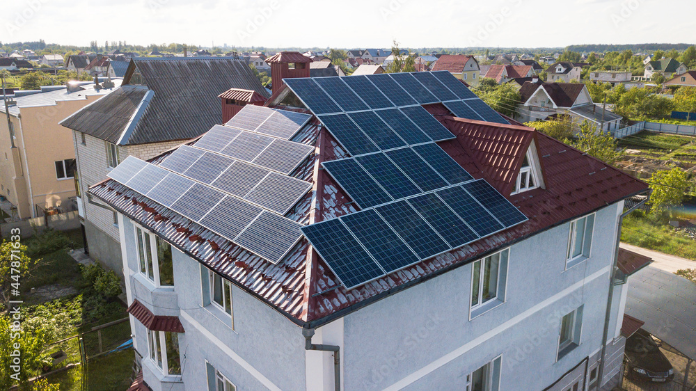 Solar panels placed on the roof of a residential, country house Solar panels placed on the roof of a residential, country house