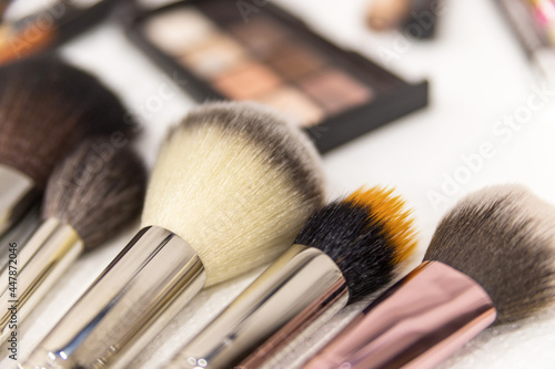 Make up the most necessary things. A set of brushes and professional cosmetics on the makeup artist's desk. Everything for applying makeup. Suitable for your beauty blog. Flatly. Soft focus. 
