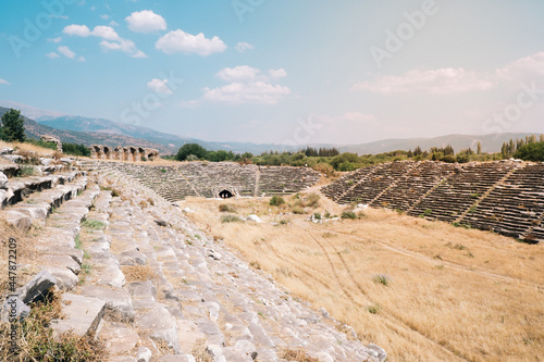 The giant stadium in the ancient city of Aphrodisias. Ancient stadium with 30 thousand seats. Historical buildings in the ancient city of Aydın Karacasu. Ruins in the ancient city. Selective focus.