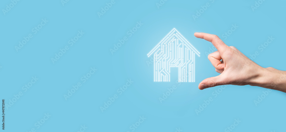 Hand hold house icon.Smart home controlled, intelligent house, and home automation app concept.Pcb design and person with smart phone. Innovation technology internet Network Concept. Hand hold house icon.Smart home controlled, intelligent house, and home automation app concept.Pcb design and person with smart phone. Innovation technology internet Network Concept.