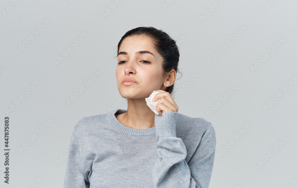 sick woman wiping face with handkerchief cold isolated background sick woman wiping face with handkerchief cold isolated background