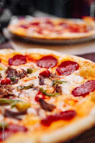 Hot Pepperoni Pizza with Mozzarella cheese, salami, Tomato sauce, pepper, Spices. Italian pizza