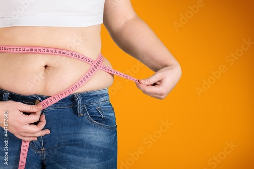 Female fat figure with measuring tape