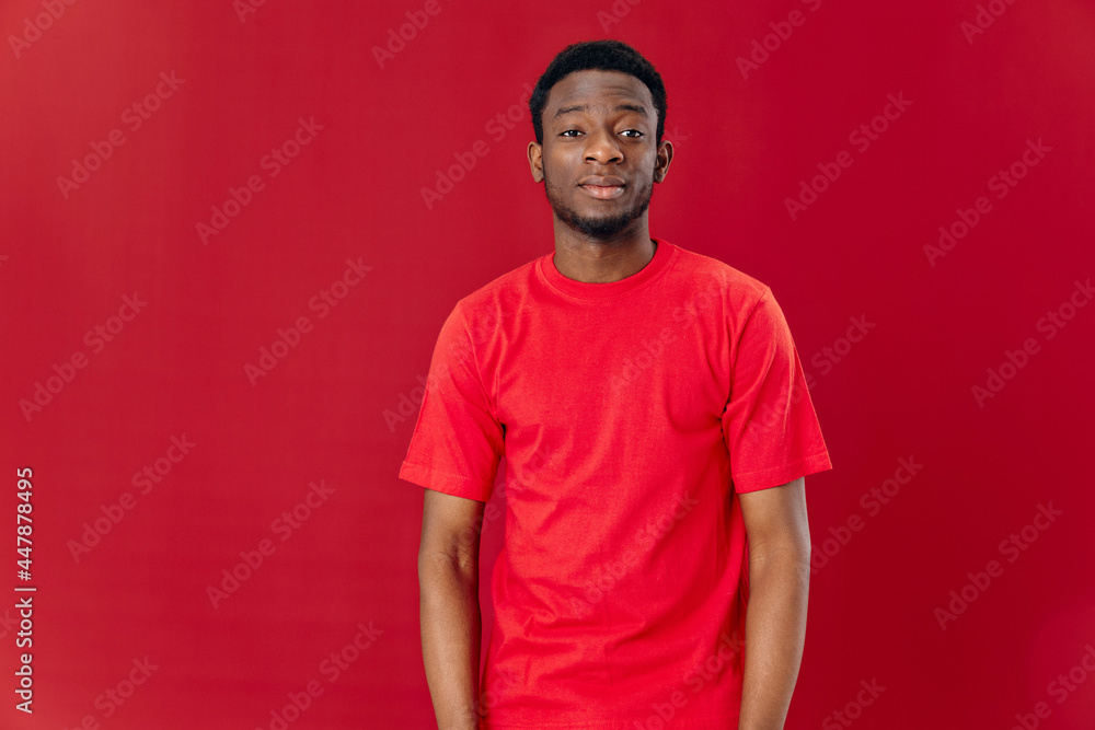 african looking man in red t-shirt cropped view studio