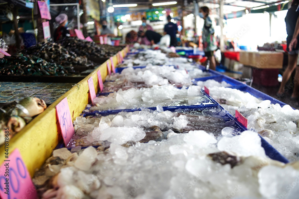 frozen seafood by ice at seafood market