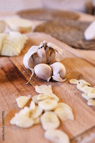 Garlics in a wooden cutting board waiting to be cooked 